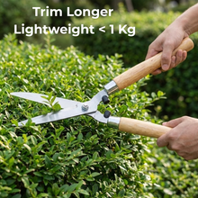 Load image into Gallery viewer, Person trimming a bush with garden shears, text indicating 'Trim Longer Lightweight < 1 Kg'.
