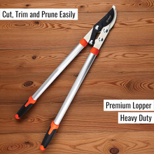 Load image into Gallery viewer, Heavy-duty lopper on a wooden surface with text indicating its use and quality.
