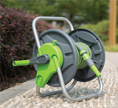 A green and gray hose reel stand with a capacity to store 45m hose, displayed outdoors.